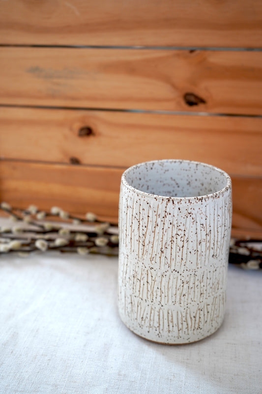 Speckled carved white vase